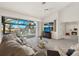Bright living room with sliding glass doors to the pool and fireplace at 9277 St Paul Dr, Port Charlotte, FL 33981