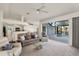 Open concept living room with kitchen view and sliding glass doors to the pool at 9277 St Paul Dr, Port Charlotte, FL 33981