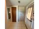 Hallway to kitchen with access to the exterior at 5428 Nutmeg Ave, Sarasota, FL 34231