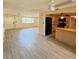 Spacious living area featuring tiled floors and an open layout to the kitchen at 5428 Nutmeg Ave, Sarasota, FL 34231
