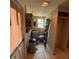 Small utility room with hot water heater, ladder and storage space at 5428 Nutmeg Ave, Sarasota, FL 34231