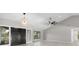 Bright living room with vaulted ceilings and modern lighting fixtures at 5474 Dominica Cir, Sarasota, FL 34233
