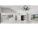 Open floor plan featuring new floors, high ceilings, modern lighting, and an updated kitchen at 5474 Dominica Cir, Sarasota, FL 34233