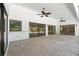 Spacious patio with ceiling fans and brick flooring, perfect for outdoor entertaining with a view of the pool at 5474 Dominica Cir, Sarasota, FL 34233