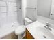 Clean bathroom with a shower, a toilet and a sink with cabinets at 923 Brenton Leaf Dr, Ruskin, FL 33570