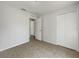 Bedroom featuring closet, tile floors, and access to another room at 923 Brenton Leaf Dr, Ruskin, FL 33570