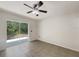 Bedroom with sliding glass doors leading to the backyard and tile floors at 923 Brenton Leaf Dr, Ruskin, FL 33570