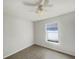Bright bedroom with a ceiling fan, a white wall and a window at 923 Brenton Leaf Dr, Ruskin, FL 33570