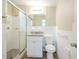 Bathroom featuring a glass shower, a toilet, and a modern vanity at 1314 Larsen Ln, Tampa, FL 33619