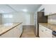Bright kitchen featuring granite counters, modern cabinets, and stainless appliances at 1314 Larsen Ln, Tampa, FL 33619