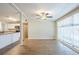 Open-concept living area seamlessly connecting to the modern kitchen with granite countertops at 1314 Larsen Ln, Tampa, FL 33619