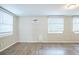A spacious living room with hardwood flooring and many windows at 1314 Larsen Ln, Tampa, FL 33619