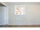 Bright living room boasts wood-look flooring and a pass-through to the kitchen at 1314 Larsen Ln, Tampa, FL 33619