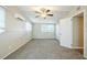 Comfortable bedroom featuring plush carpet, a ceiling fan, and a window with natural light at 1314 Larsen Ln, Tampa, FL 33619