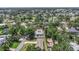 Stunning aerial view of a landscaped neighborhood featuring lush green trees and beautiful single Gathering homes at 4925 Alcazar S Way, St Petersburg, FL 33712