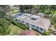 Aerial view of the home showcasing its lush surroundings, pool and spacious layout at 4925 Alcazar S Way, St Petersburg, FL 33712