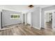 Bright bedroom featuring hardwood floors, a closet, and a window with a view of the outdoors at 4925 Alcazar S Way, St Petersburg, FL 33712