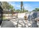 Wooden pool deck featuring an enclosed pool and adjacent storage shed in a well shaded yard at 4925 Alcazar S Way, St Petersburg, FL 33712