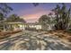 Charming single-story home featuring a spacious driveway and an open carport at 4925 Alcazar S Way, St Petersburg, FL 33712