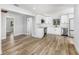 Modern kitchen with white cabinets, stainless steel appliances, and wood-look flooring at 4925 Alcazar S Way, St Petersburg, FL 33712