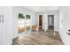 Spacious living room with sliding glass door, hardwood floors, and modern white trim and doors at 4925 Alcazar S Way, St Petersburg, FL 33712