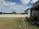 Spacious backyard enclosed by a white fence, offering privacy and space for recreation or relaxation at 11317 Village Brook Dr, Riverview, FL 33579