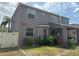 Back exterior of the home, featuring a partially covered patio overlooking a spacious backyard at 11317 Village Brook Dr, Riverview, FL 33579