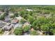Aerial view of the home showcasing its prime location surrounded by lush trees and greenery at 12219 Hunters Lake Dr, New Port Richey, FL 34654