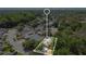 An aerial view highlights property lines in a suburban community with mature landscaping and nearby amenities at 12219 Hunters Lake Dr, New Port Richey, FL 34654