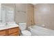 Bathroom showcasing a tub, shower, wood vanity, and modern fixtures at 12219 Hunters Lake Dr, New Port Richey, FL 34654