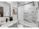 Elegant bathroom with marble countertops, stylish fixtures, and a shower-tub combo at 1807 49Th W Ave, Bradenton, FL 34207