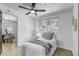 Bedroom with a comfortable bed, a large window, and dining area in the distance at 1807 49Th W Ave, Bradenton, FL 34207