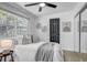 Comfortable bedroom with a plush bed, natural lighting, and closet with mirrored doors at 1807 49Th W Ave, Bradenton, FL 34207