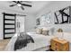 Bright bedroom with neutral decor, ceiling fan, barn door, and stylish wall art at 1807 49Th W Ave, Bradenton, FL 34207