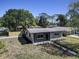 Charming single-story home with a well-maintained yard, gray exterior, and a modern roof at 1807 49Th W Ave, Bradenton, FL 34207