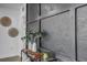 Hallway decorated with modern art and stylish console table, with decorative vases and accessories at 1807 49Th W Ave, Bradenton, FL 34207