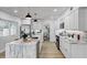 Modern kitchen with white cabinetry, marble countertops, stainless steel appliances, and island at 1807 49Th W Ave, Bradenton, FL 34207