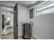 The utility room features a modern water heater, circuit panel, and a window for natural light at 1807 49Th W Ave, Bradenton, FL 34207
