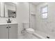 Modern bathroom with white marble tile, shower niche, and vanity at 1820 Marvy Ave, Tampa, FL 33612
