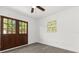 Cozy bedroom with patio doors, natural light, and wood-look flooring at 1820 Marvy Ave, Tampa, FL 33612