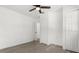 Neutral bedroom with closet, ceiling fan, and wood-look floors at 1820 Marvy Ave, Tampa, FL 33612