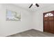 Bedroom with wood-look floors, good light and wood door at 1820 Marvy Ave, Tampa, FL 33612