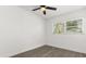 Bright bedroom with neutral walls, wood floors, and ample natural light from the window at 1820 Marvy Ave, Tampa, FL 33612