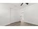 Bedroom with wood-look floors, closet and neutral walls at 1820 Marvy Ave, Tampa, FL 33612