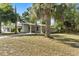Charming home exterior featuring a lush front yard and beautiful landscaping, inviting you inside at 1820 Marvy Ave, Tampa, FL 33612