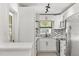 Modern kitchen with white cabinets, stainless steel appliances, and stylish mosaic backsplash at 1820 Marvy Ave, Tampa, FL 33612