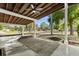 Covered patio with a ceiling fan providing a comfortable outdoor space for relaxation and entertaining at 1820 Marvy Ave, Tampa, FL 33612
