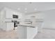 Bright kitchen with granite counters, stainless appliances, white cabinets, and an island at 3504 Kearsney Abbey Cir, Dover, FL 33527