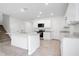 Kitchen with a center island and stainless appliances seamlessly integrated with the living space at 3504 Kearsney Abbey Cir, Dover, FL 33527