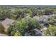 Aerial view of a residential area with well-maintained homes and lush greenery at 4432 Huddlestone Dr, Wesley Chapel, FL 33545